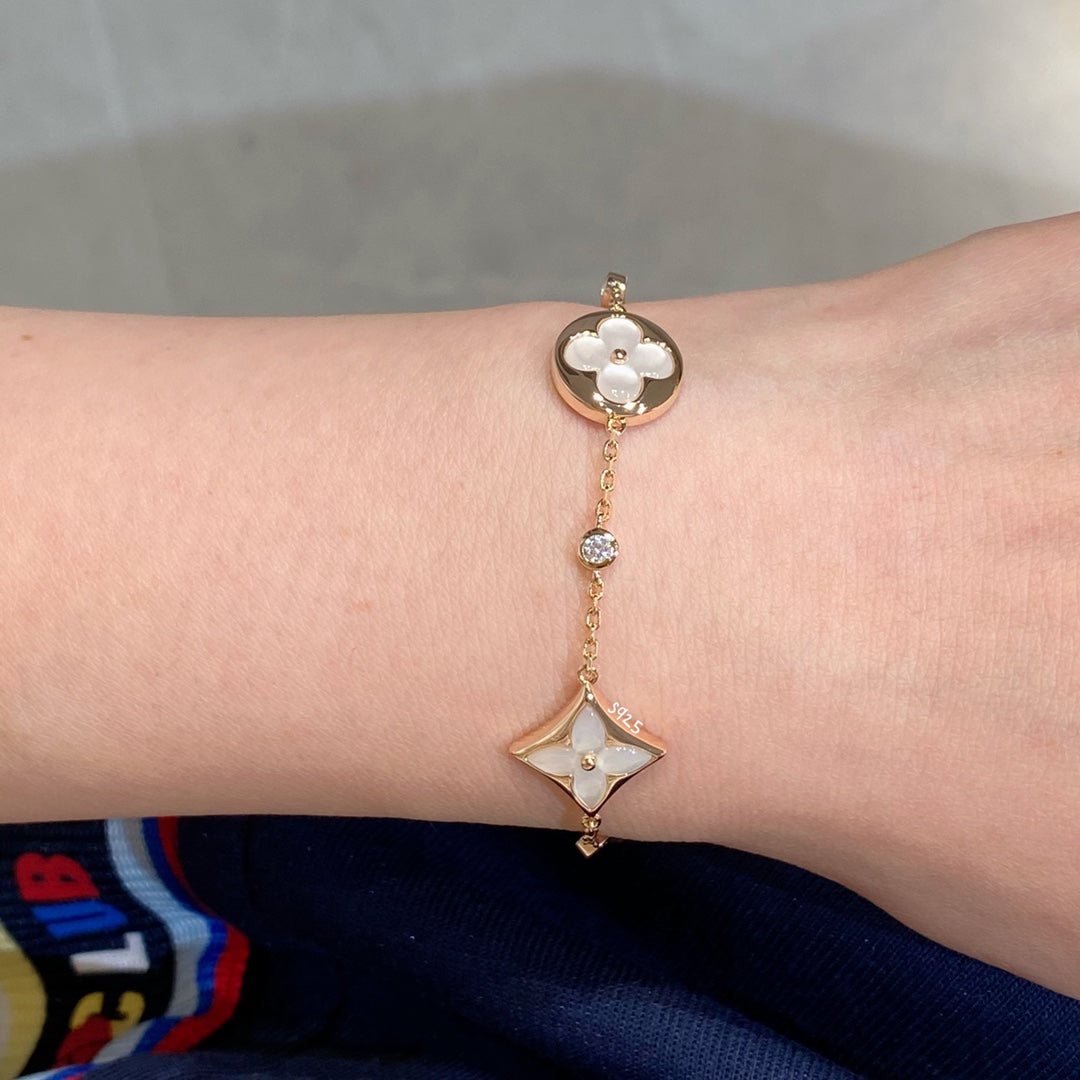 STAR AND SUN 4 MOTIF WHITE MOP PINK GOLD BRACELET VIP