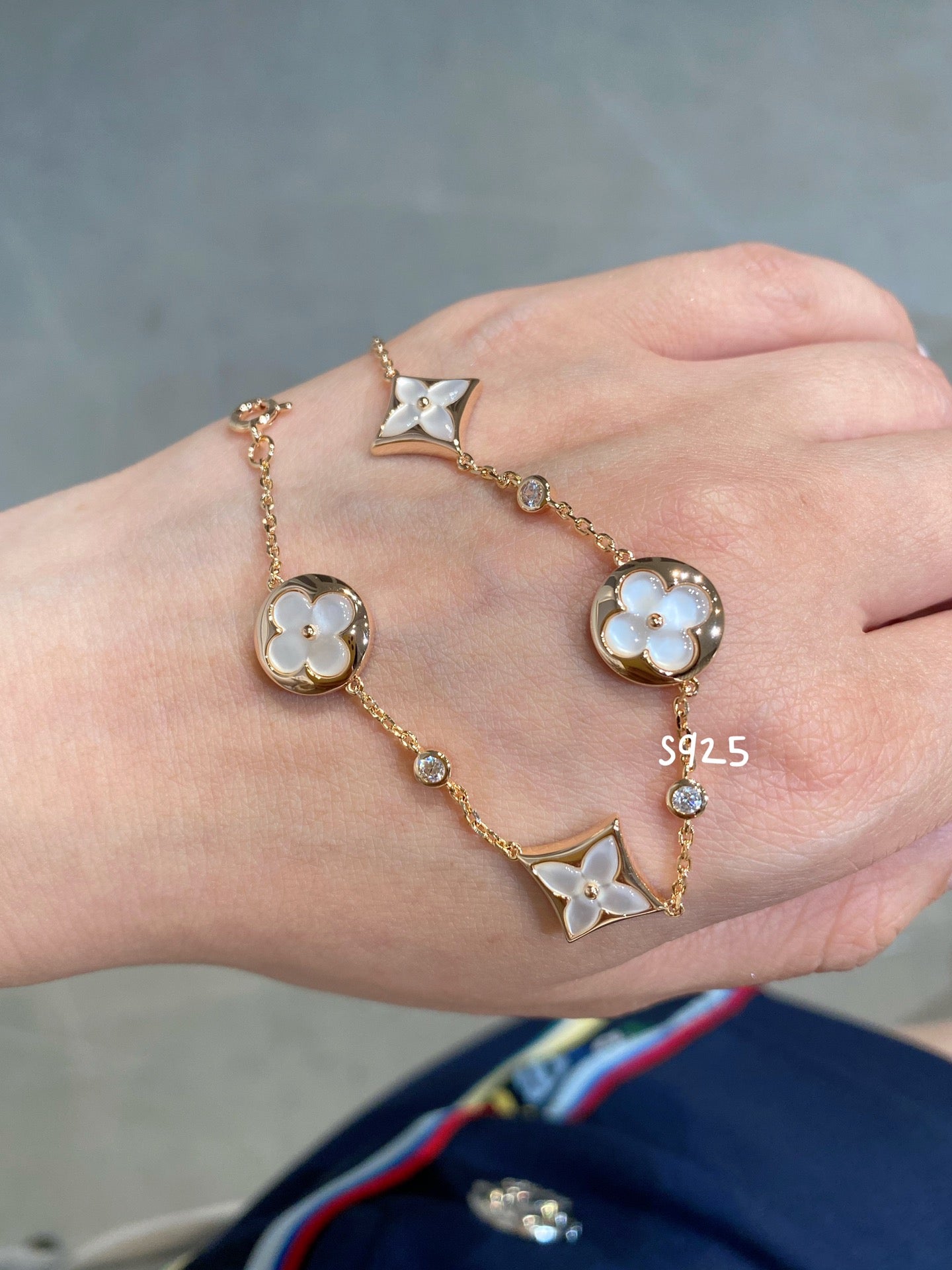 STAR AND SUN 4 MOTIF WHITE MOP PINK GOLD BRACELET VIP