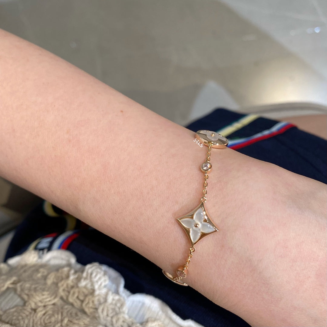STAR AND SUN 4 MOTIF WHITE MOP PINK GOLD BRACELET VIP