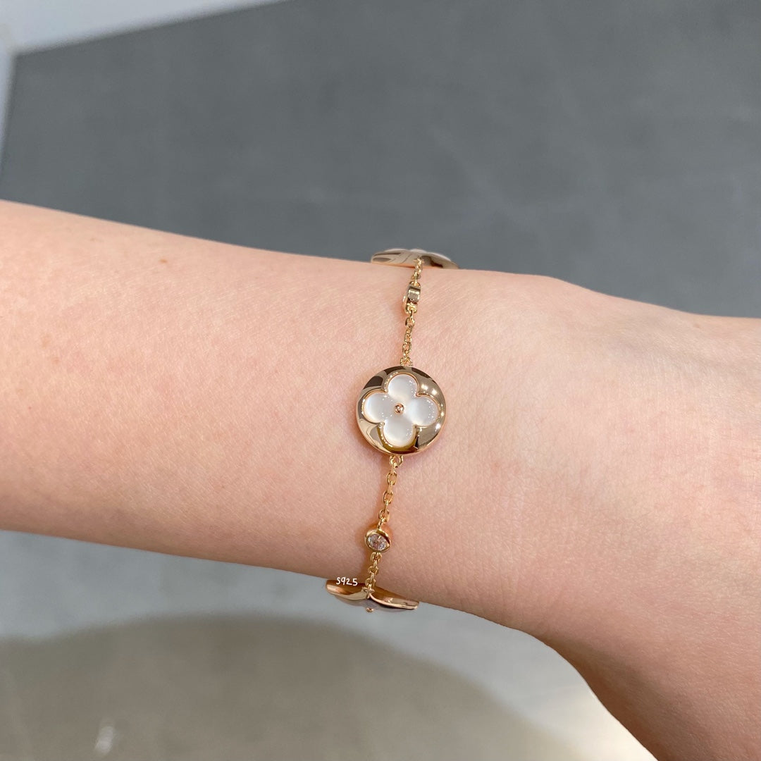 STAR AND SUN 4 MOTIF WHITE MOP PINK GOLD BRACELET VIP
