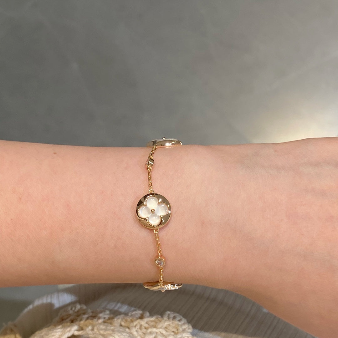 STAR AND SUN 4 MOTIF WHITE MOP PINK GOLD BRACELET VIP